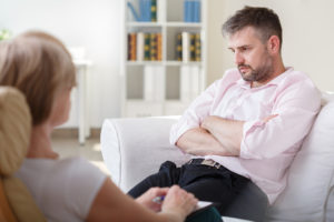 Image of man with alcoholism having counselling
