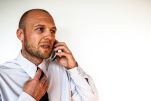 Image of businessman calling counsellors on phone